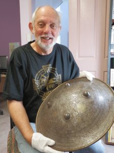 Michael Strong holding an IndoPersian Shield