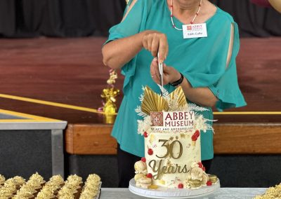 Edith Cuffe cutting 30 years cake